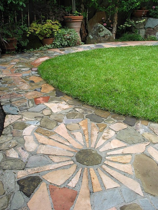 a creative stone and concrete garden pathway looks catchy and fits a casual and simple garden