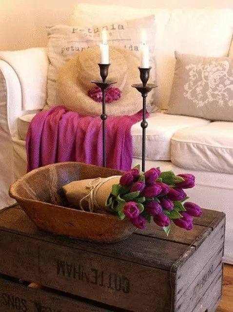 a wooden bowl with purple tulips in kraft paper is a pretty centerpiece or decoration