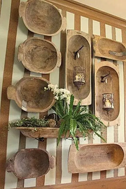 a whole wall covered with antique dough bowls, and a bowl used as a planter
