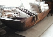 storing towels and pillows in a dough bowl is a cool and simple idea with a rustic feel