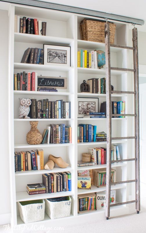 Adding a rustic moving ladder would add a special filling to simple Billy bookcases.