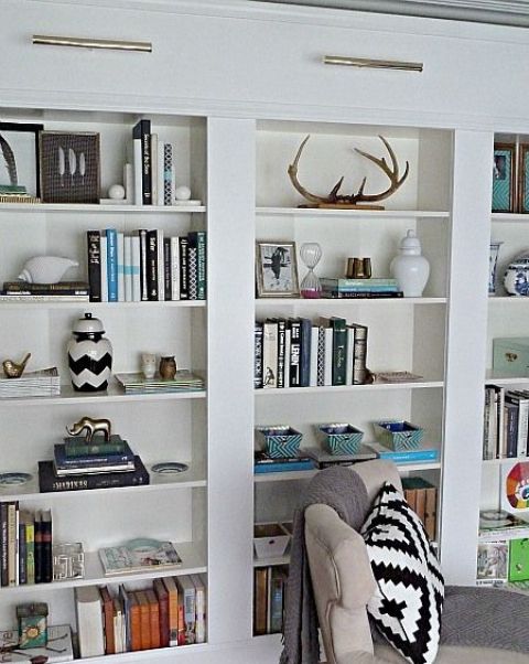 You can make a bunch of Billy bookcases look like a real built-in. It won't be a pricey project!