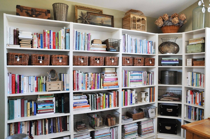 Several bookcases connected together provide a LOT of storage space for books, magazines, boxes and other stuff.
