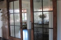 double sliding barn doors with rain glass will brign some privacy and a rustic touch