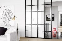 a glass framed sliding door to let light in and out and to make the space gently separated