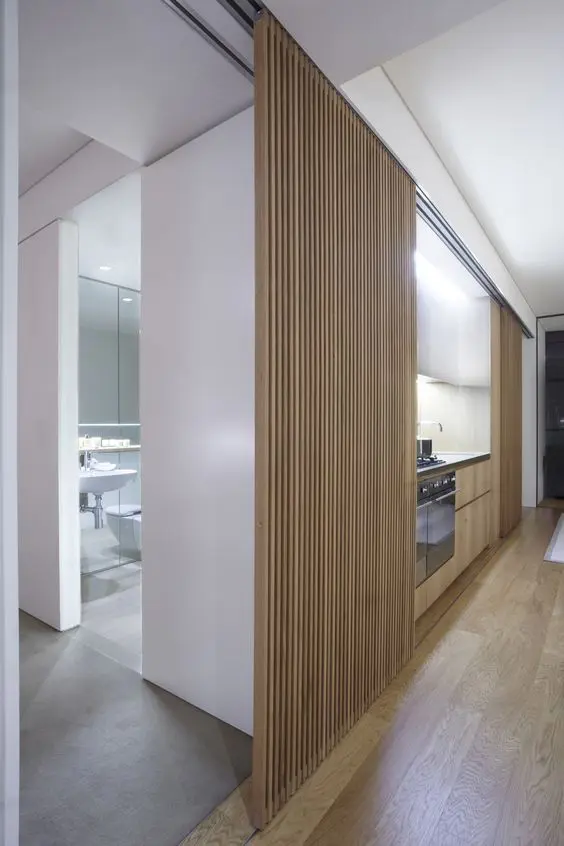 a wooden plank sliding door for a minimalist space