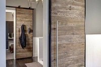 a vintage and rustic sliding door with dark metal framing for a cozy feel