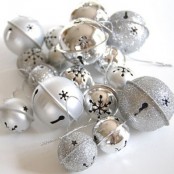silver and silver glitter bells can be used throughout your home for Christmas decor – they brilliantly bring the spirit in