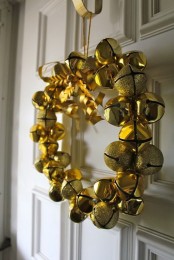a gold bell and gold glitter bell Christmas wreath is a gorgeous and very glam holiday decoration to rock