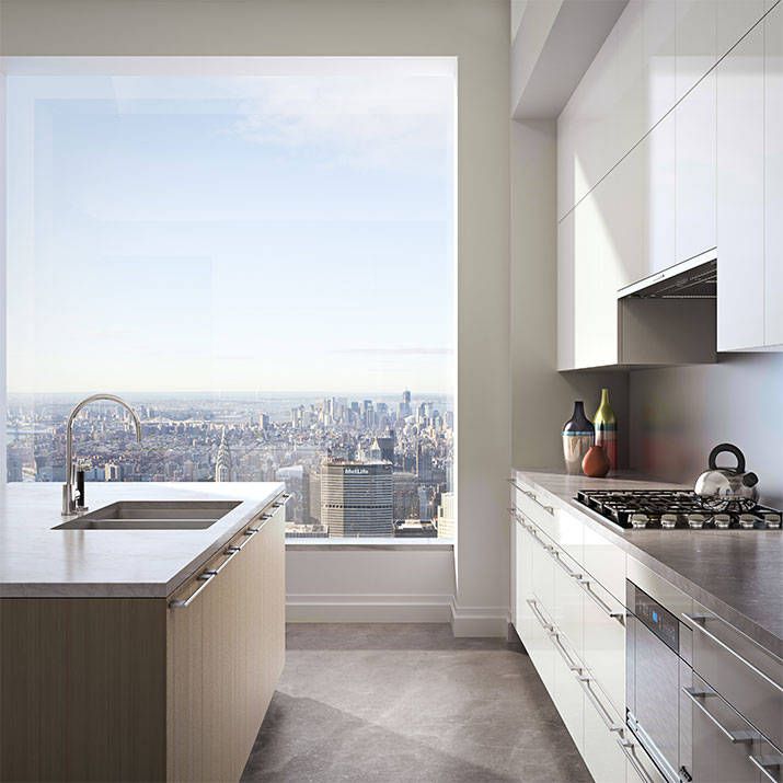 A beautiful contemporary kitchen with sleek plain white cabinets, stone countertops and a wood backsplash, a light stained kitchen island with a white sotne countertop and a gorgeous view of the big city