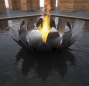 a metal water lily as a fire bowl installed right in the center of the pool is a lovely idea for pairing two elements – water and fire with a spectacular touch