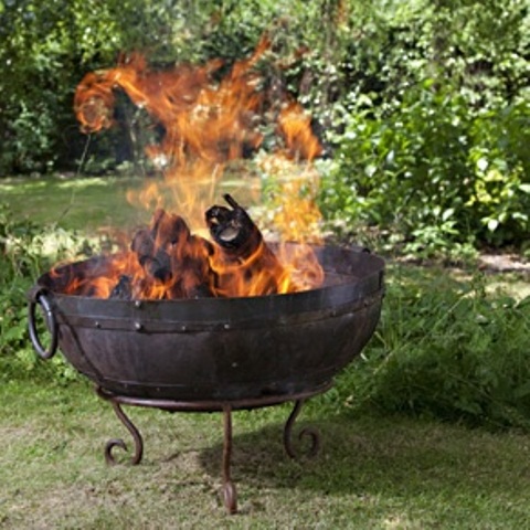 A large forged fire bowl on exquisite legs is a cool idea for any relaxed or vintage inspired backyard