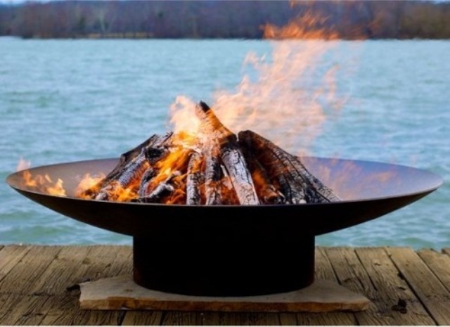 A metal fire bowl on a stand is always a good idea, vary the size according to your outdoor space size and shape