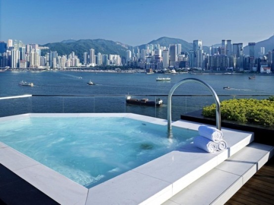 a geometric outdoor jacuzzi with a fantastic harbor and big city view is a fabulous place to relax in, and these views are unforgettable