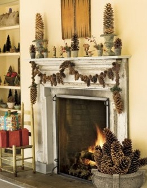 Pinecone topiaries and a pinecone garland is a great solution to dress up your fireplace for holidays.