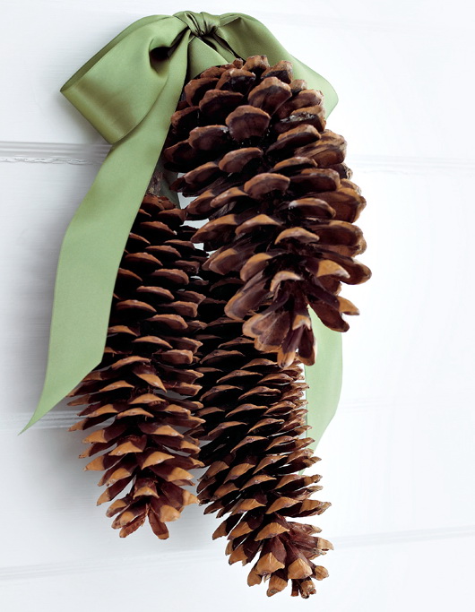 A DIY pinecone door hanger is probably the most easy craft project there is. It's perfect to make with your kids.