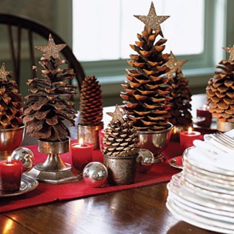 Pinecones in small vintage cups and buckets could resemble Christmas trees if you put shiny stars on top of them.