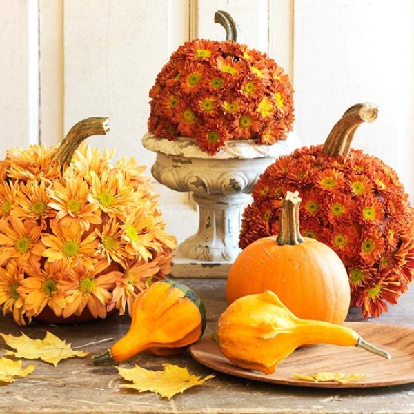 If you want to make a statement cover some pumpkins in your arrangement with mums.