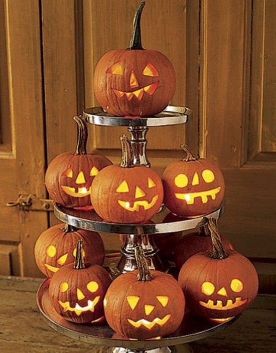 A bunch of glowing carved pumpkins could become a beatuiful centerpiece for Halloween.