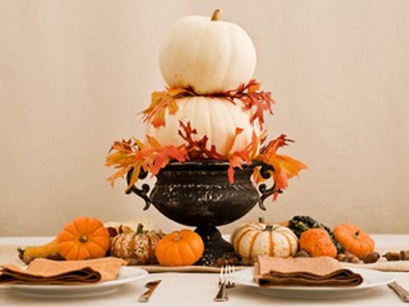 Choose several flat-bottomed pumpkins in graduated sizes and put them in a bowl. Add some fall leaves and a gorgeous centerpiece is done.