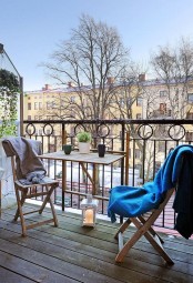a practical balcony decor with folding furniture