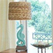 a rustic coastal table lamp with a seahorse base and a rafia lampshade is a cool idea for a beach farmhouse