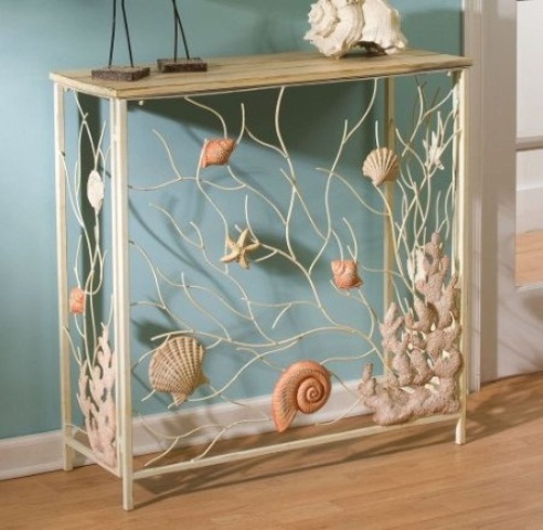 a catchy delicate console table with seashells, starfish and corals in natural colors for a beautiful seaside entryway