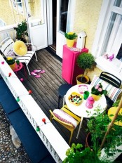 colorful pillows, bright pots with blooms and colorful furniture are amazing for spring and summer in your balcony