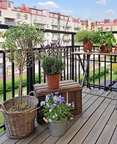 Potted greenery and blooms are all you need to turn your balcony into a fresh spring filled space