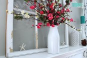 a summer mantel with bright blooms, a vintage window, starfish and turquoise candles