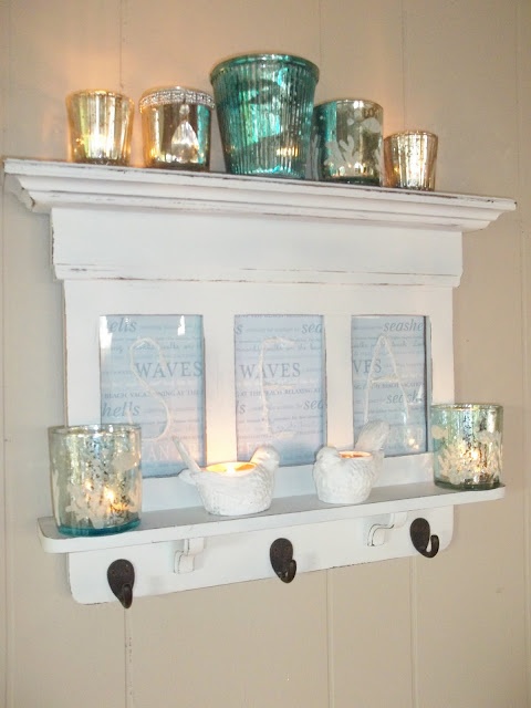 a faux beachy mantel with candle lanterns, signs, corals will add to the space