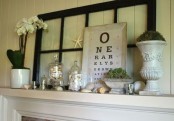 an eclectic summer mantel with blooms, greenery, shells in jars, starfish and other stuff