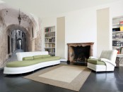 a contemporary refined living room with an antique city wall mural that visually expands the space making it eye-catching
