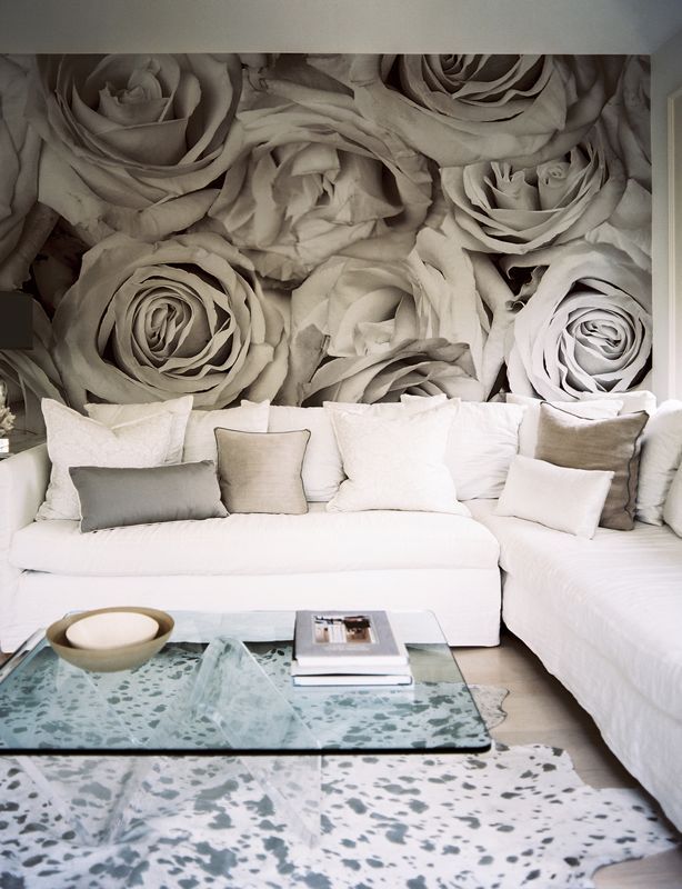 A contemporary living room with a neutral floral wall mural for eye catchiness and a romantic touch in the space