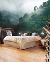 a contemporary bedroom done with a gorgeous nature wall mural that makes it feel like it’s a tropical space