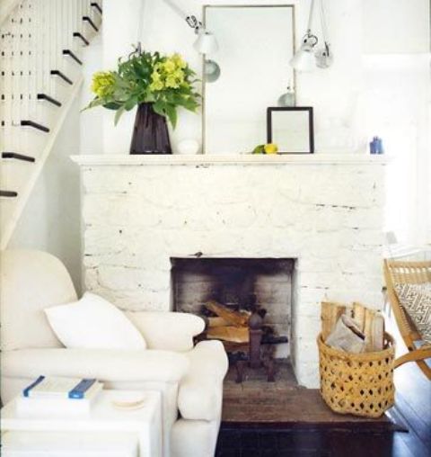 A whitewashed stone non working fireplace will bring coziness to the space and elegance at the same time