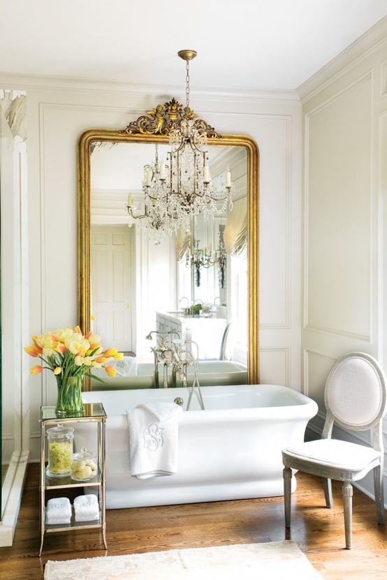 Finish off your refined bathroom with some bright blooms in a vase   it will be a chic and bold touch