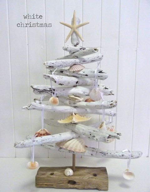a whitewashed driftwood Christmas tree decorated with seashells and starfish is a pretty Christmas decoration