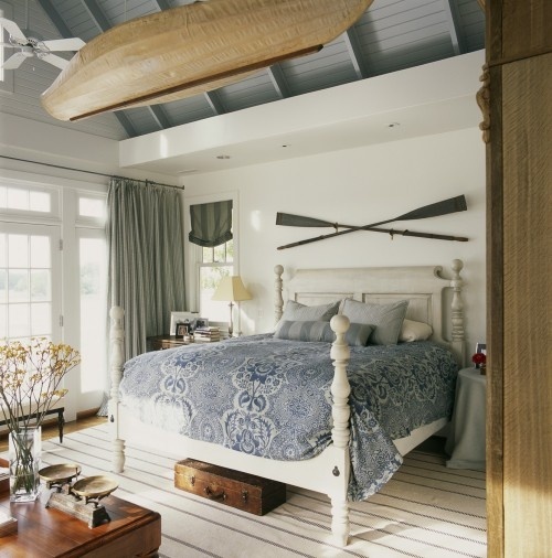 If you wish to go bold then hang a bout in your bedroom. Traditional wooden oars are also a great addition.