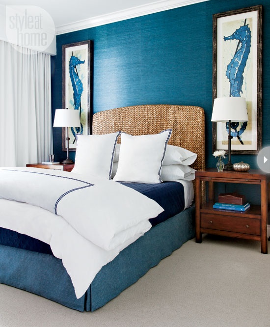 Awesome shade of blue is combined with oversized pictures of sea horses in this gorgeous bedroom design.