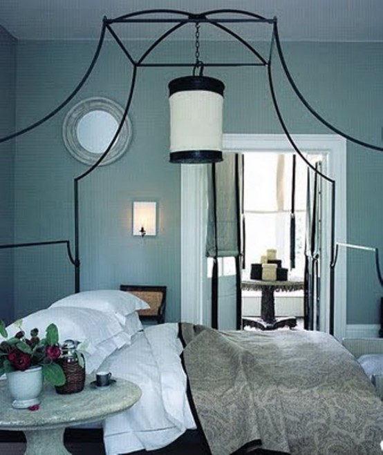a tiffany blue bedroom in vitnage style, with a large forged bed and grey bedding