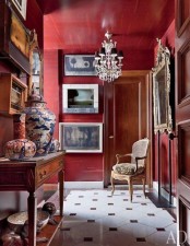 a refined entryway done with burgundy walls – for those who are ready to paint and repaint the spaces