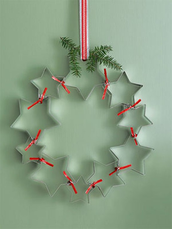 Clean off old cookie cutters for a charming decoration you can hang on any wall you want.