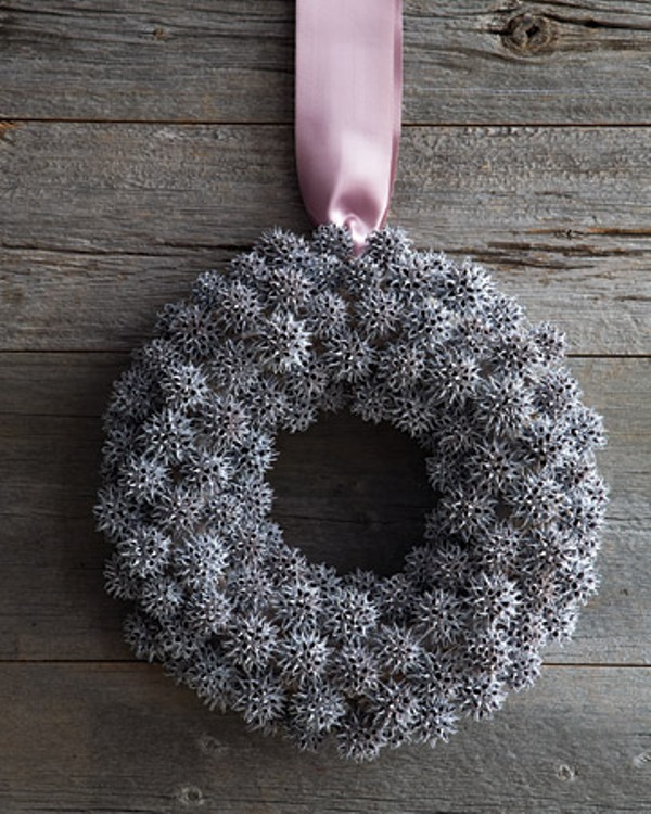 Use hot-glue to adhere pinecones to a grapevine wreath. Apply a light coat of white spray-paint to create a frosted finish.
