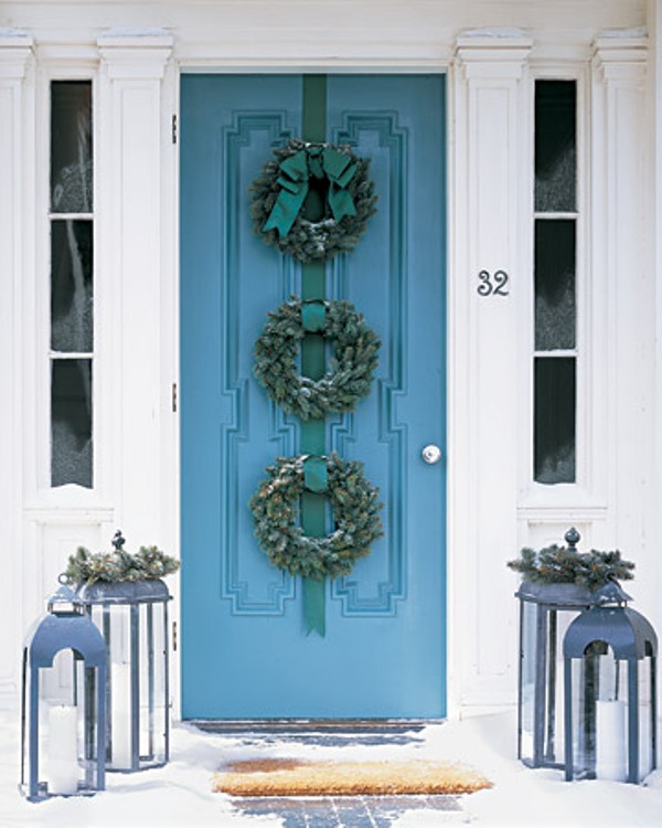 Who said one wreath is enough? Hang several similar wreaths on one door to make it looks special.