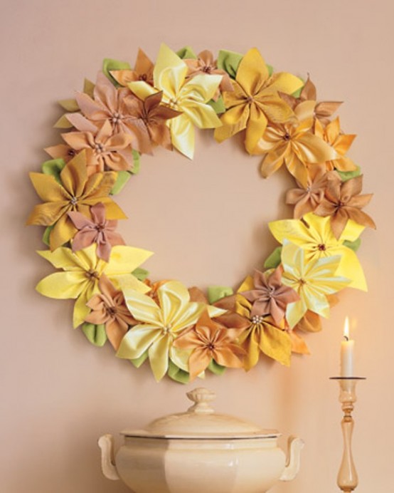 Brighten your walls with a wreath made of ribbon. It's great idea to make poinsettias and glue them together to remind the shape of a traditional wreath.