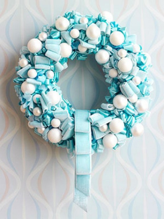 Adding snowballs to ribbon wreath is a great way to add winter touch to its decor.