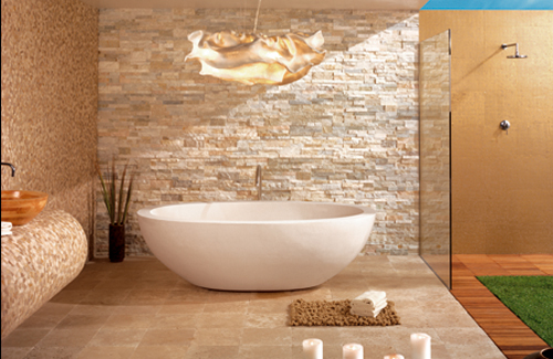 a taupe and gold bathroom done with faux stone, various tiles and wooden panels