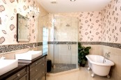 a taupe, beige and brown bathroom with white appliances and touches of various prints here and there