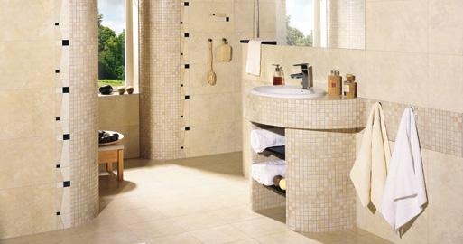 a beige and taupe bathroom done with small tiles and white appliances